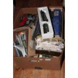 Collection of model railway accessories including track, engines, rolling stock, etc.