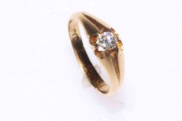 18 carat gold and single stone diamond gypsy set ring, size O.