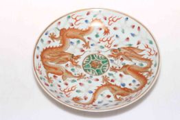 Chinese porcelain plate decorated with dragons, six character marks to base, 21cm diameter.