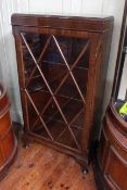 Mahogany astragal glazed single door bookcase with three adjustable shelves,