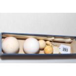 Two ivory snooker balls, two smaller balls, page turner and box (6).