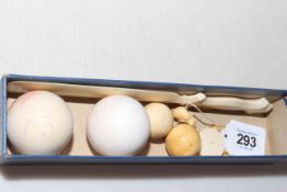 Two ivory snooker balls, two smaller balls, page turner and box (6).