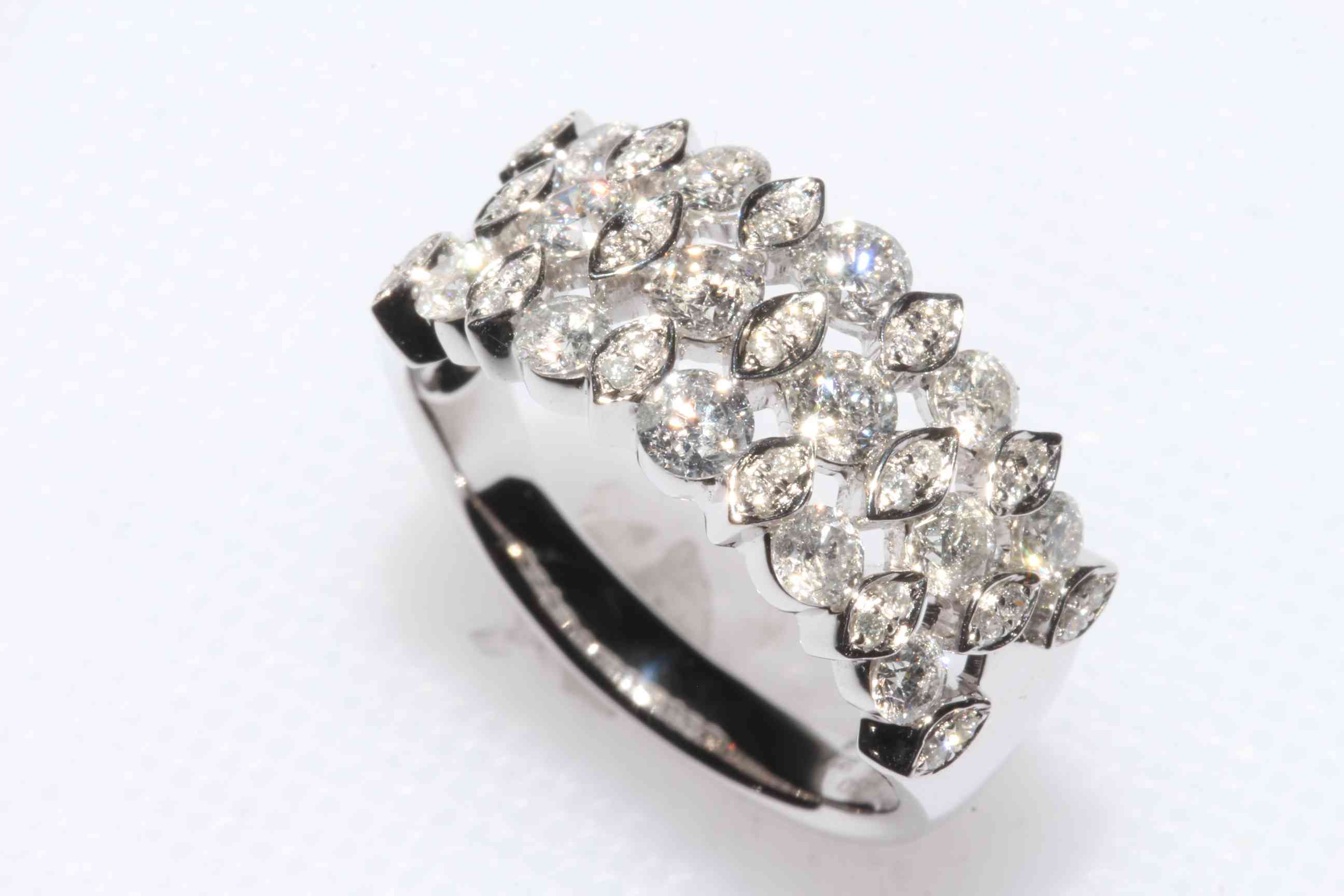 Platinum and diamond cluster ring, having forty eight brilliant cut diamonds in three rows, size O,