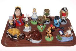 Collection of twelve Wade figures including Alice in Wonderland and Wind in the Willows pieces.