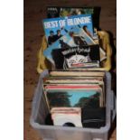 Two boxes of LP records and singles including Beatles, John Lennon, Moody Blues, Motorhead, etc.