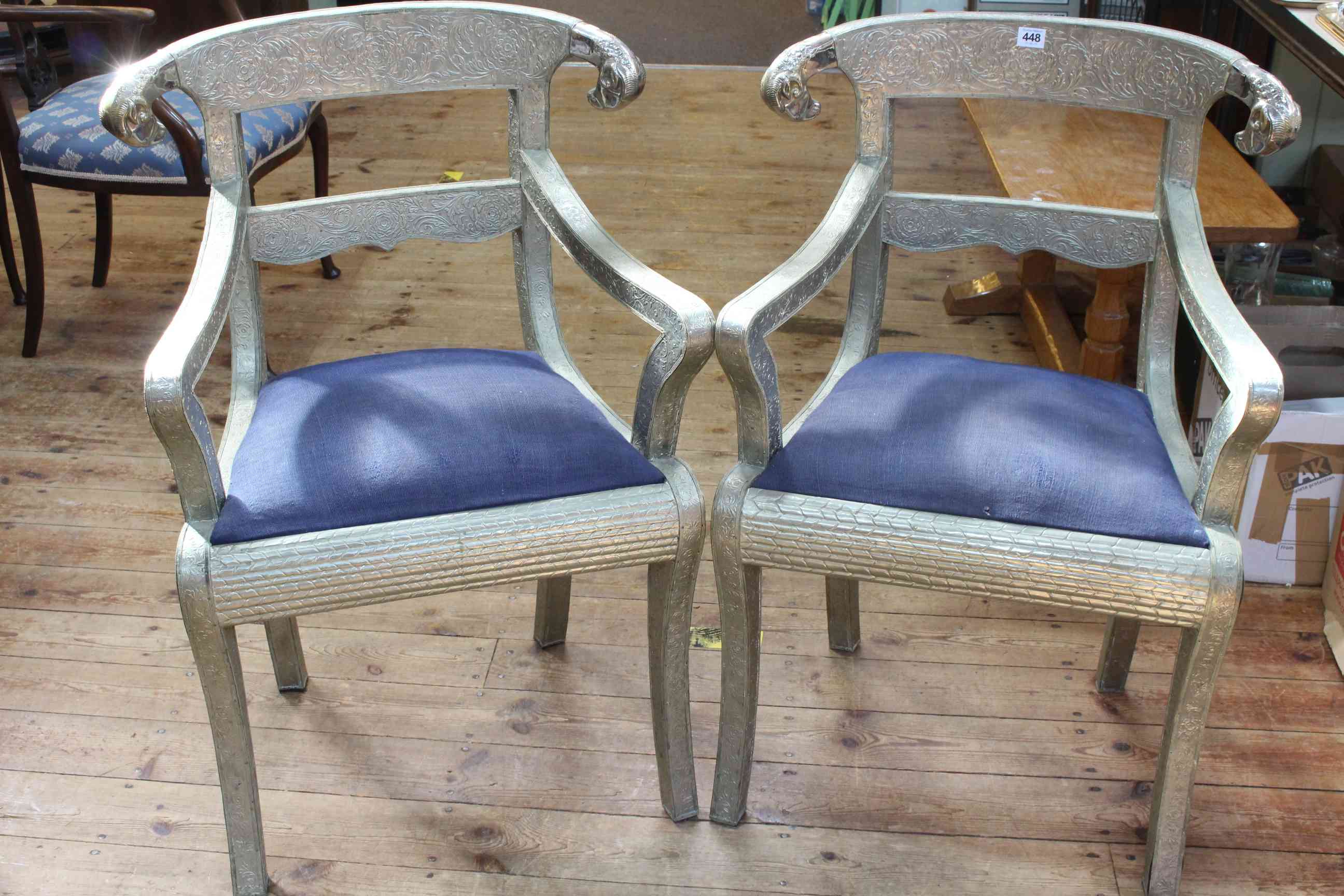 Pair white metal covered bar back elbow chairs.