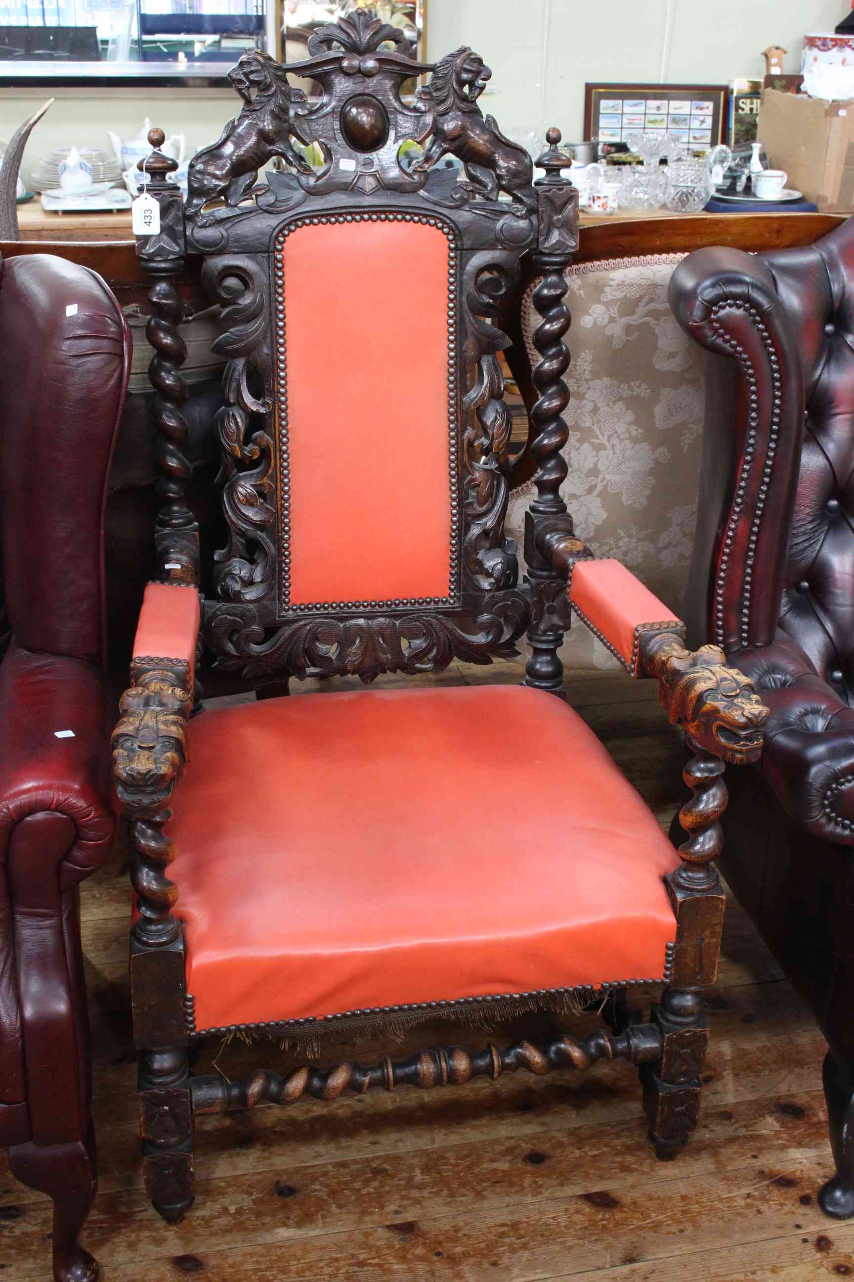 Victorian heavily carved oak open armchair.