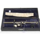 Cased vintage measuring instrument.