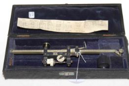 Cased vintage measuring instrument.