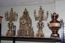 Ornate gilt metal three piece clock garniture and a copper samovar.