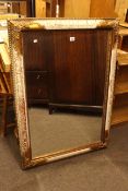 Gilt and painted frame bevelled wall mirror, 106cm by 76cm overall.