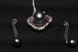 Sterling silver Tahitian pearl ring and matching earrings.