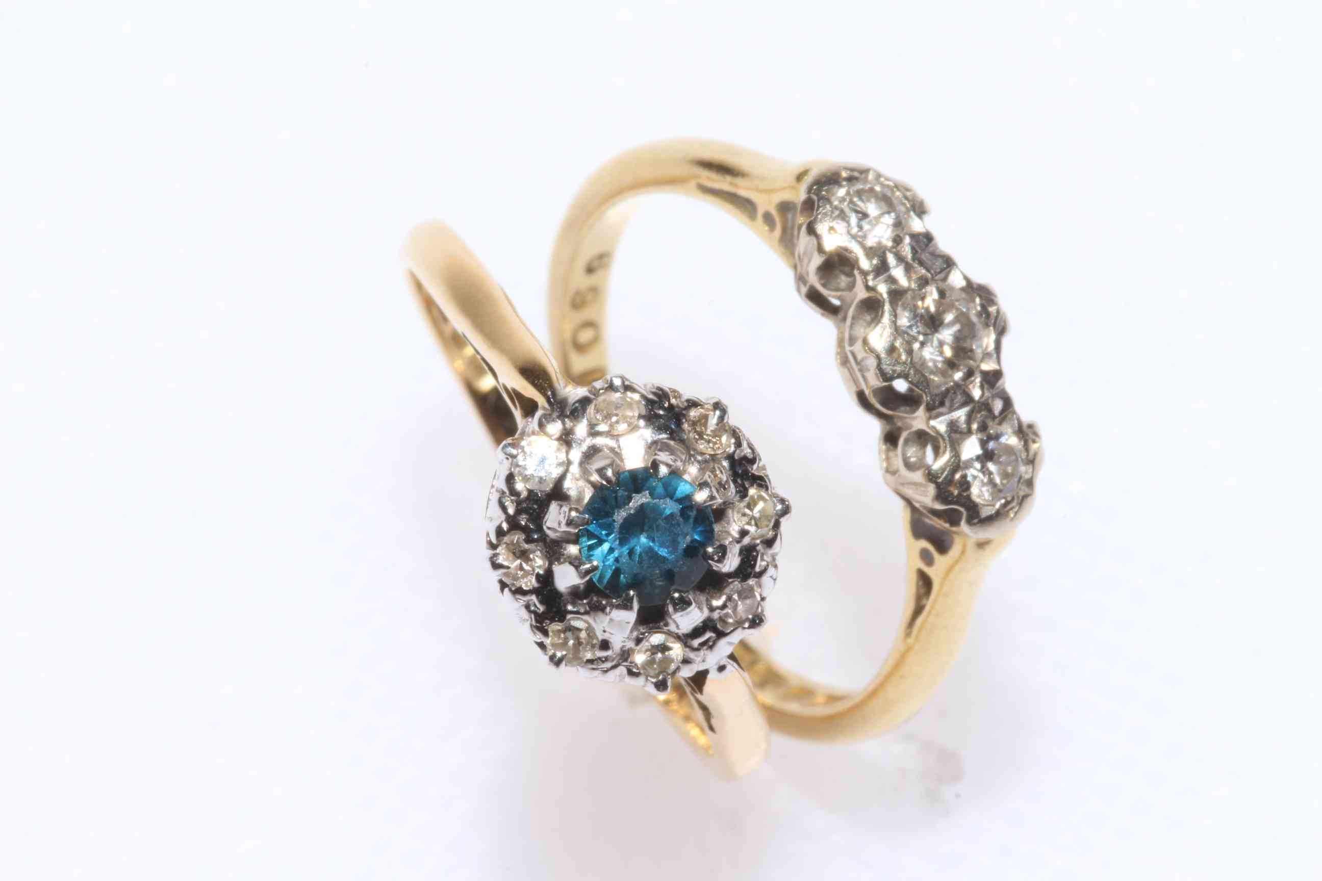 18 carat gold three stone diamond ring, size J/K, and 18 carat gold, sapphire and diamond ring,