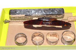 Silver topped long dressing table box, four silver napkin rings and silver hat pin (6).