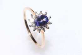 Tanzanite and zircon 9 carat gold cluster ring, size P/Q, with certificate.