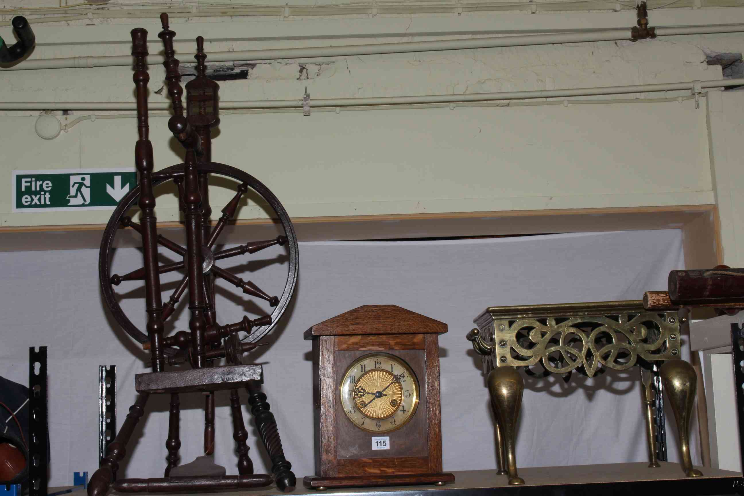 Circa 1920's oak mantel clock, brass footman and a spinning wheel on stand (3).