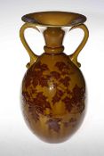 Linthorpe Pottery two handled vase decorated with leaf design on a mustard ground, impressed no.