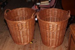 Two large wicker baskets with handles, 60cm high.