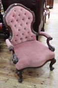 Victorian mahogany framed open armchair in rose pink buttoned fabric.