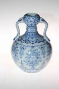 Chinese blue and white two handled vase with floral design, six character mark to base, 25.5cm.