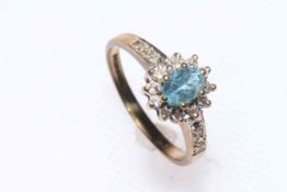 9 carat gold, blue topaz and diamond cluster ring, size N.