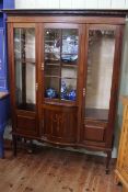 Edwardian inlaid mahogany three door vitrine on square tapering legs to spade feet,