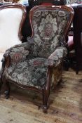 Victorian mahogany framed gents chair in floral pattern fabric.