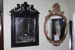 Victorian carved oak framed bevelled wall mirror and circular gilt framed wall mirror (2).