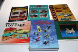 Six toy collectors reference books.