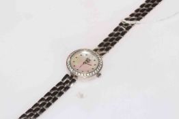 EON silver bracelet watch with mother of pearl face.