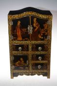 Oriental black lacquer table cabinet with seven compartments, 48cm by 28cm by 16cm.