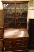 Georgian mahogany bureau bookcase having two astragal glazed doors above a fall front with four