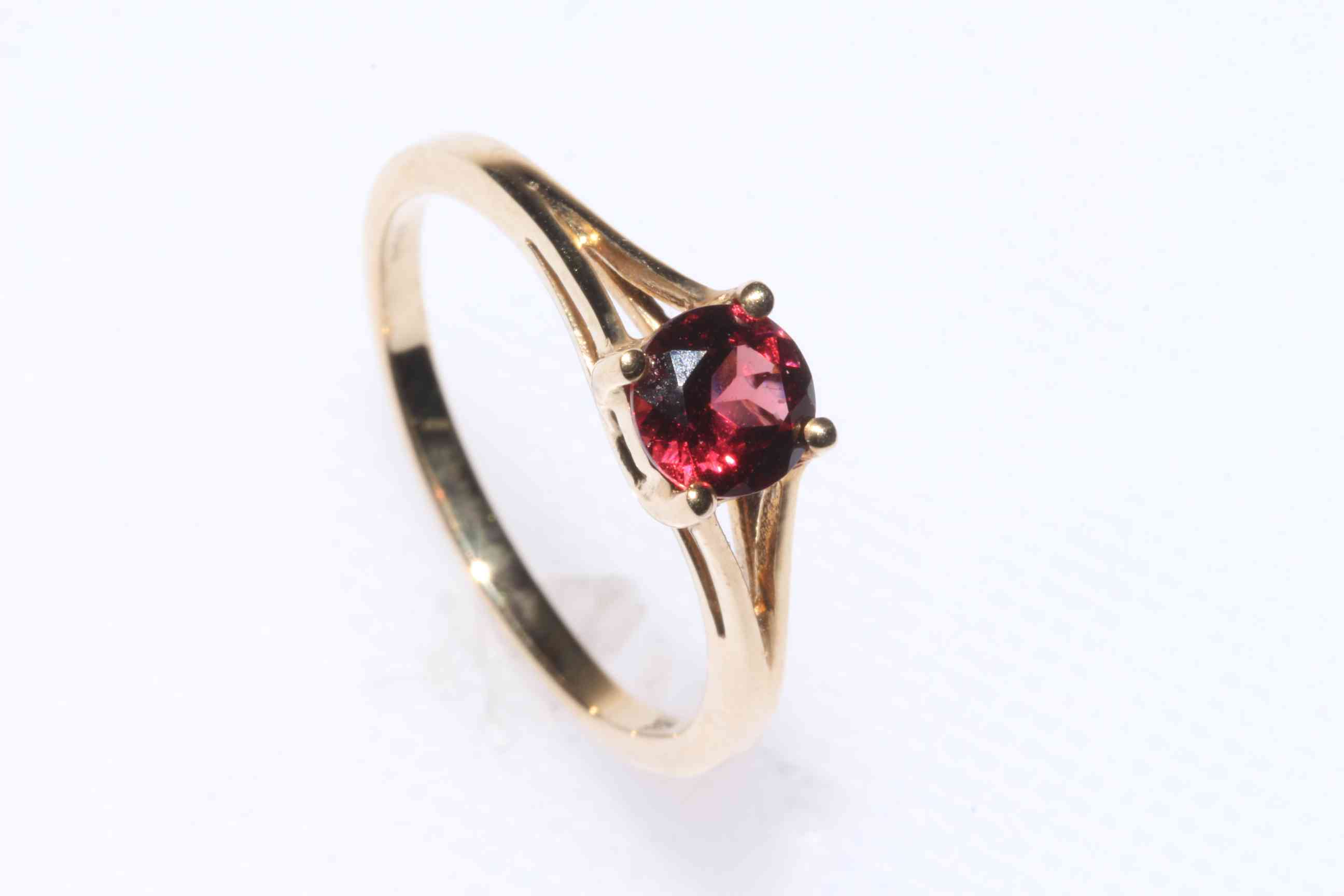 9k gold and garnet ring, size N/O, with certificate.