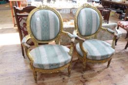 Pair French gilt carved oval panel back fauteuils.