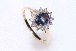 Tanzanite and diamond 14k cluster ring, oval tanzanite 1.25 carat, size R, with certificate.