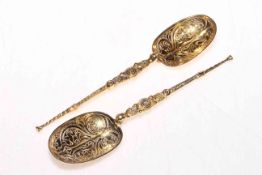 Pair silver gilt 'anointing' spoons, hallmarked for London 1910, 17cm length.