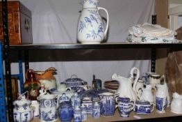 Blue and white pottery including Ringtons, Spode, Masons, tureen, urn with lid, relief jugs, linens,