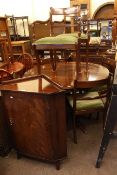 Circular mahogany extending pedestal dining table,