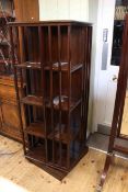 Mahogany four tier revolving bookcase, 157cm high by 60cm wide.