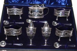 Cased silver seven piece cruet set plus five spoons, Birmingham 1910/11,