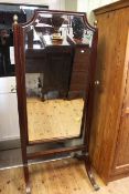 Georgian mahogany cheval mirror on splayed legs to brass paw feet, 174cm high by 82cm wide.