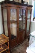 Edwardian inlaid mahogany three door vitrine on square tapering legs to spade feet,