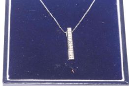 9 carat white gold and twelve diamond set pendant and chain.