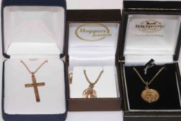 Three 9 carat gold St. Christopher and cross pendants with chains.