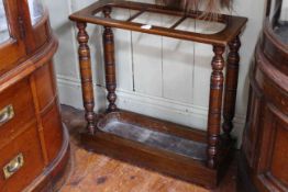 Victorian oak three division stick stand with turned pillars, 61.5cm high by 61cm wide by 24cm deep.