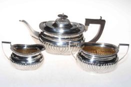 Silver three piece tea set having part fluted bodies, Birmingham 1939, with original retailers box.