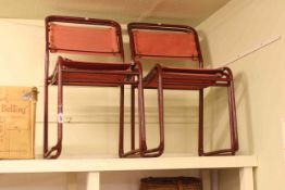 Set of four vintage Cox & Co. stacking chairs.