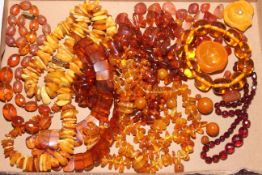 Box of amber or amber colour beads, necklaces, etc.