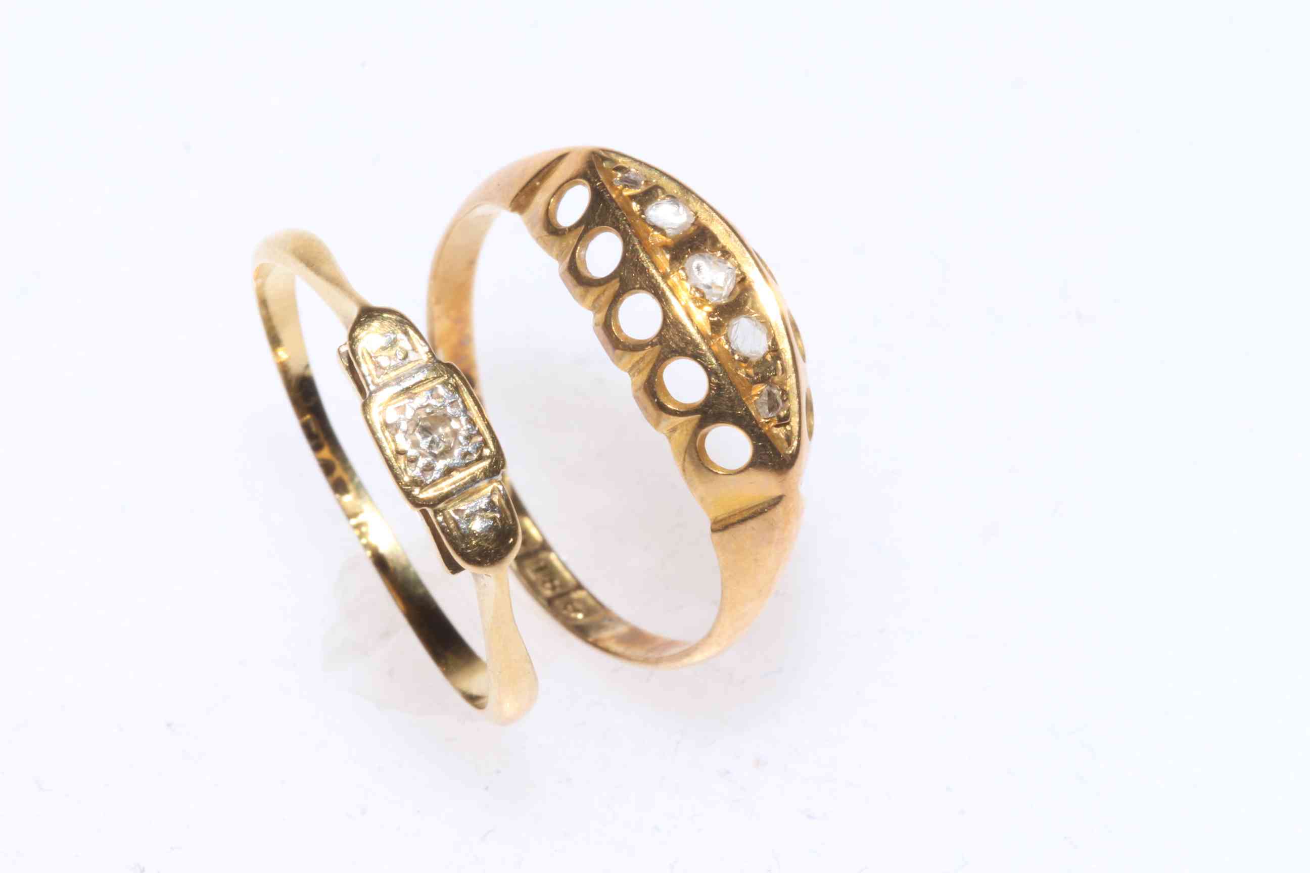 Two small 18 carat gold and diamond set rings, size K/L.