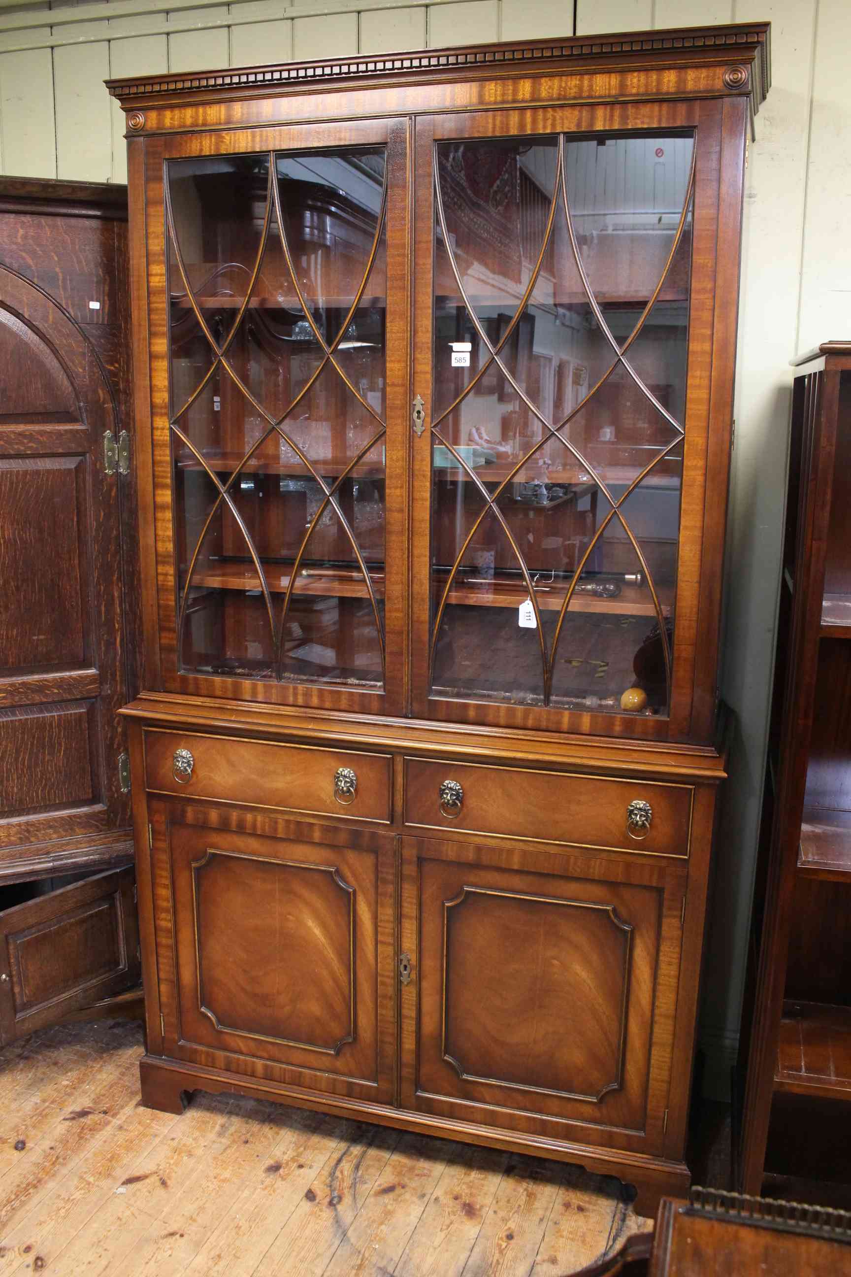 Siesta mahogany four door cabinet bookcase, 207cm high by 115cm wide by 40cm deep.